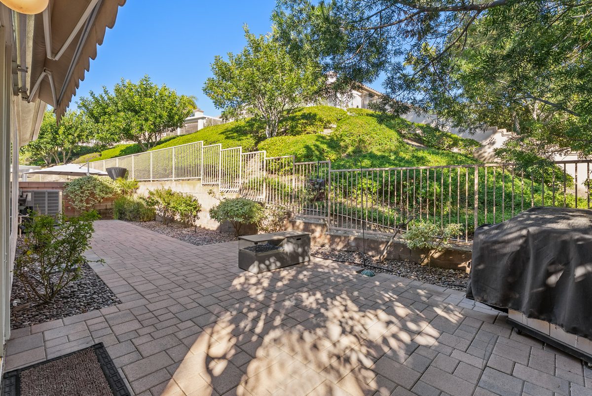 Paver patio backing to greenbelt